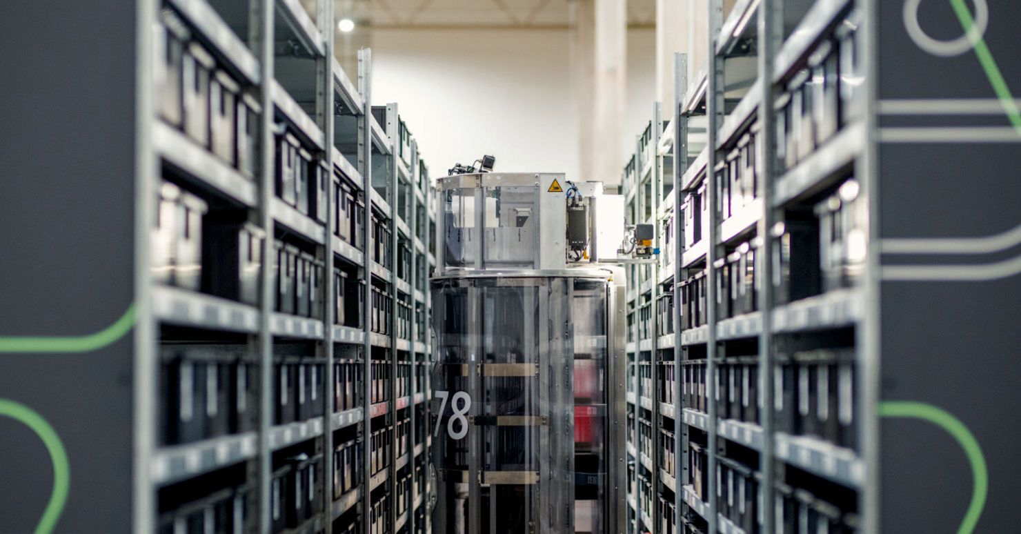 Intralogistics automation — AMR robot in warehouse aisle