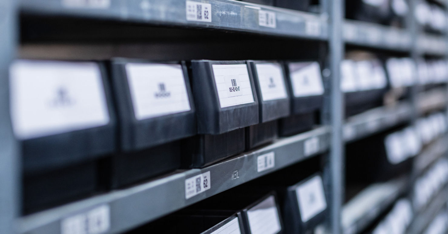 Crowded warehouse shelves illustrating space shortage