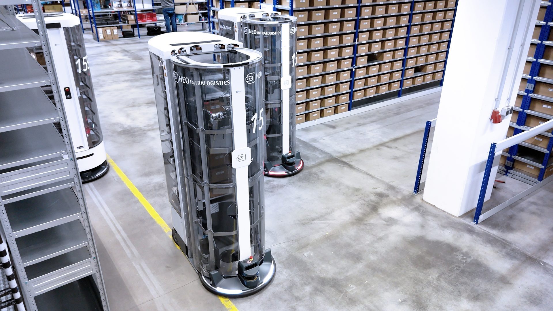 Several autonomous mobile robots operating in a warehouse